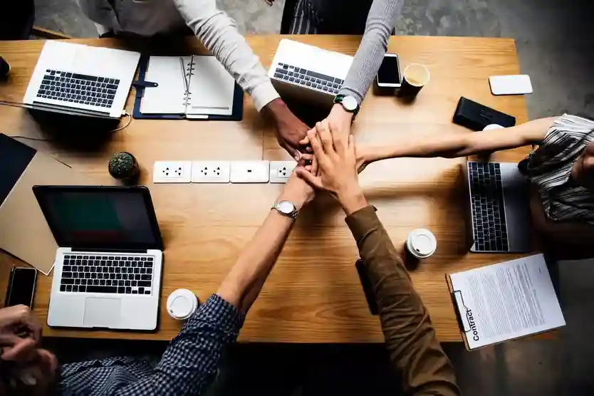 team-business-people-stacking-hands-scaled_834x556_11zon (1)